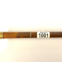 An antique high ct gold topped walking cane.