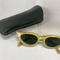 A pair of late 1950 or early 1960s Italian simulated mother of pearl sunglasses with a green case.