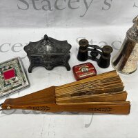 A Vintage fan with carved wood sticks. A stirrup cup pewter box onyx egg ornament cigarette case opera glasses.