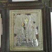 A Russian Icon on wood with a silver background . frame size 40x46cm.