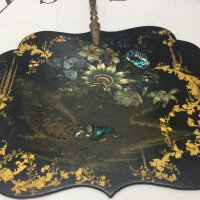 A Victorian paper mache fan (24cm wide) with decoration of flowers and peacock, and wooden handle.