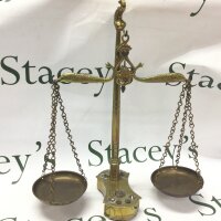 A 19th century brass set of small beam scales with seven original weights, 37Cm tall.