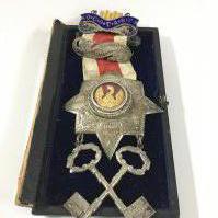 A Freemason medal from the grand Surrey lodge.; presented by the brothers of the grand Surrey lodge to Brode Williams for his services as treasurer, may 12th 1891.