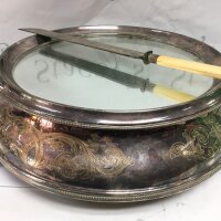A silver plated cake stand and knife.