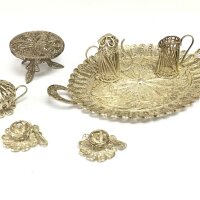 A miniature filigree tea set.