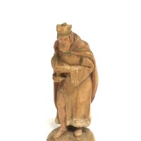 A small carved fruitwood figure, approx height 8cm.