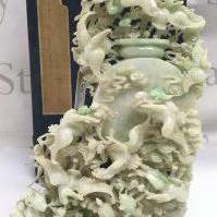 An impressive 20th century Apple Green dye Jade lidded pot surrounded by cranes and other animals, with box. Approximately 25cm tall 16cm wide .