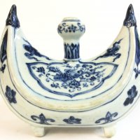 A Chinese Islamic blue and white porcelain four footed candle holder , hand painted with flowers 20cm wide, 18cm tall.