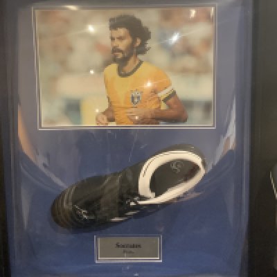Socrates Brazil Signed Framed Football Boot: Adidas Adinova left boot with autograph and picture of player above. Framed has slight damage with Perspex having a few scratches.
