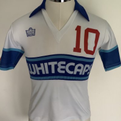 Vancouver Whitecaps 1980 Match Worn Football Shirt: Excellent condition very rare home shirt made by Admiral. Number 10 to front, rear and sleeves. Both sleeves have the Canadian flag. Size 36 attractive shirt has Taylor to rear. The NASL dissolved in 1984 with many participating teams going the same way. COA from Alan Taylor who wore number 10 in his first season.