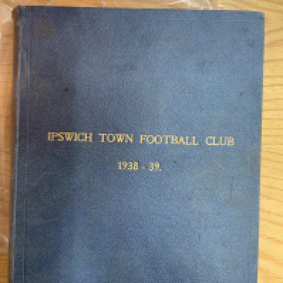 38/39 Ipswich Town Bound Volume Of Football Programmes: Blue covers with the words Ipswich Town Football Club 1938-39. Contains 23 full page programmes without covers and no single sheets. Only one with a front cover is the cellotaped in Hospital Cup match v Aston Villa. All unwritten in excellent condition.