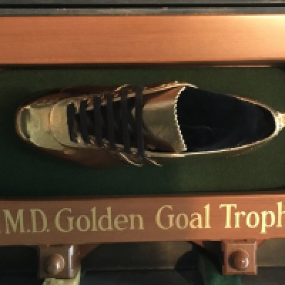 1975 West Ham FA Cup Winning Golden Boot: Stunning gold full size boot awarded to Alan Taylor for scoring the winner in the 1975 FA Cup final. Attached to green baize with wooden surround which states PMD Golden Goal Trophy. Immaculate condition as kept in wooden box and presented the evening of the match at the clubs dinner in London. Precious Metals Depositors Limited awarded this prestigious award from 1971 and in a letter from PMD Ltd to Taylor they inform him that previous winners have been Charlie George Arsenal, Allan Clarke Leeds, Ian Porterfield Sunderland and Kevin Keegan Liverpool. Both the Arsenal and the Sunderland boots are on display at the relevant clubs grounds. Incredibly rare attraction item not for posting. COA and relevant letters by Alan Taylor. Gold is not hallmarked and is not thought to be made completely of a precious metal.