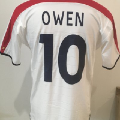 2004 Michael Owen Match Worn England Football Shirt: White short sleeve large shirt with number 10 to front and back with Owen to rear. Very bottom to front middle reads Spain v England 17 11 2004. Obtained by Peter Barnes the Tottenham and West Ham club secretary who worked also for England.