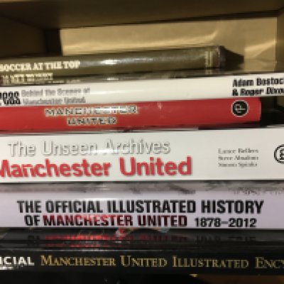 Manchester United Football Books: Excellent condition with no reserve to include Sir Bobby Charlton, Illustrated Encyclopaedia, Illustrated History, Unseen Archives, Access All Areas, Photographic History and Matt Busby autobiography with a stuck in picture signed by Denis Law. (7)