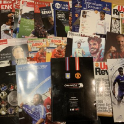 Manchester United Football Programmes: Box with no reserve of modern aways to include Charity Shields for 2007 + 2008 with tickets and a few England home and away and a couple of football writers menus all attended by fan. Excellent. ( est 40)