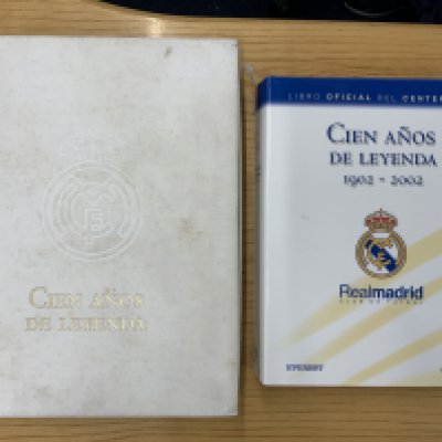 Real Madrid Cased Rare Centenary Football Book: Cine Amos De Leyenda 1902 - 2002 is a very heavy book in embossed white case which has handling marks. Book itself is excellent and has nearly 600 pages.