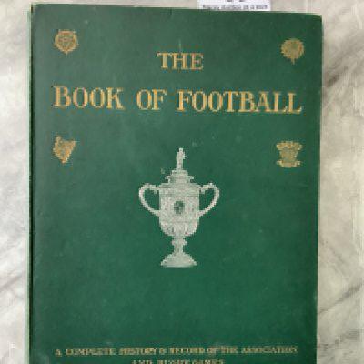 1906 Book Of Football: Large 292 page green hardback book with many pictures to include full page team groups of Leicester Fosse Watford Liverpool QPR Bolton Stoke Birmingham Fulham Newcastle Woolwich Arsenal and lots more. Cover embossed with gold wording and a silver FA Cup of the time. Fair/good with tiny tear at base of spine and foxing to a couple of pages.