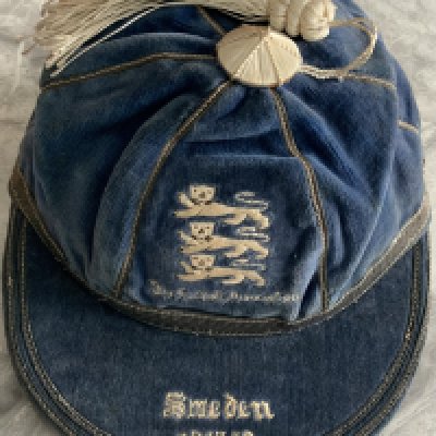 Billy Wright 1947 England International Football Cap: Blue full international cap with three lions to front and the words The Football Association underneath. The peak reads Sweden 1947-48 and refers to the 4- 2 England win in the match played at Arsenal. Billy Wright written inside.