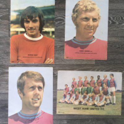 Coffer Early 1970s Football Posters: Four fantastic posters of George Best Bobby Moore Geoff Hurst which is hand signed and a West Ham team group. Creases and evidence these have been pinned at corners which are a bit worn. (4)