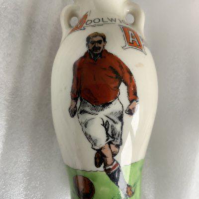 1911 Woolwich Arsenal Football Jug: Excellent condition 3 inches high jug. One side depicts an Arsenal player below the words Woolwich Arsenal and the reverse has the words English League First Division. Maker Grays Sports to base. Please note this was made in 1911 and Grays Sports used number 588114 on all its football pottery and other teams that have been unearthed are Fulham Manchester United Burnley and Gainsborough Trinity.
