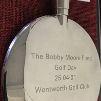Bobby Moore ( West Ham ) Fund Hip Flask: Expensively made quality hip flask awarded to West Ham ex player Roger Cross at Wentworth in 2001. Unused and like new with engraving.