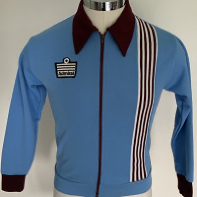 West Ham 1976 ECWC Final Tracksuit Top: Stunning light blue with claret trim zip up track suit top with Admiral to breast. Worn in Brussels on the occasion of the European Cup Winners Cup final v Anderlecht by 47th minute substitute Alan Taylor who has provided a COA.