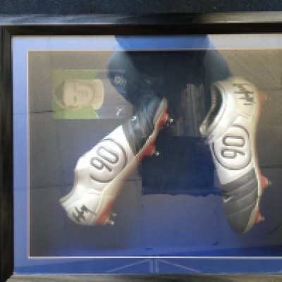 Wayne Rooney Signed Framed Football Boots: Nike 90 boots both hand signed and expensively framed with a picture in the background of Rooney in Everton kit. It is very possible these were worn by him but we did not get this confirmed and there was a period he wore this style when at Everton. The vendor was a contributor to the Everton Former Players Foundation and received these from the club.