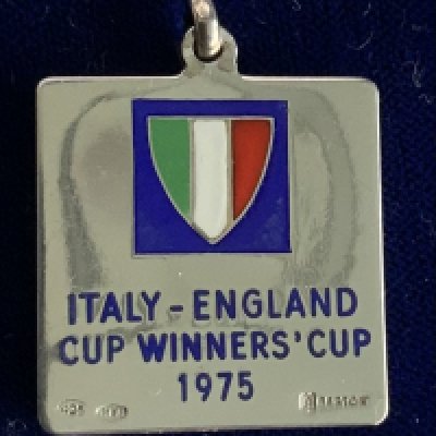 1975 West Ham Anglo Italian Cup Winners Cup Final Football Medal: Silver 925 boxed runners up medal for the two legged final. Match was winners of the FA Cup v winners of Coppa Italia Fiorentina and not to be confused with the Anglo Italian Cup. Football action scene to one side and below Italian flag to reverse are the words Italy- England Cup Winners Cup 1975. Awarded to Alan Taylor who has provided a COA.