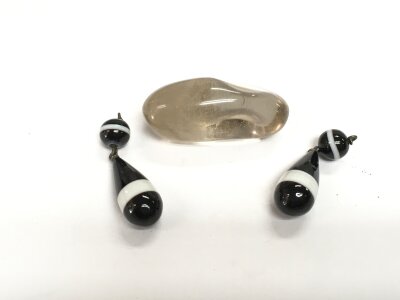A rock crystal bead and a pair of black banded agate drops.