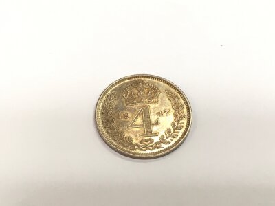 A 1947 four pence Maundy coin.