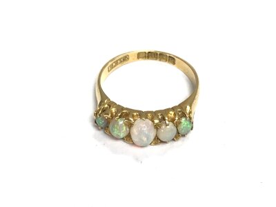 An 18ct gold Opal 5 stone ring. 3.40g and size L