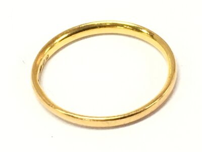 A 22ct gold band ring, size M. 2g