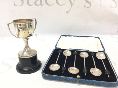 A silver hallmarked cycling trophy  and a set of silver hallmarked coffee spoons