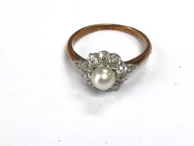 A Pearl and white stone ring. Size J
