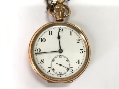 A gold plated pocket watch with chain. Winds and runs.