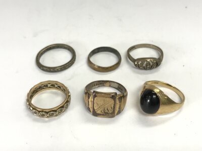A collect or six gold and silver rings.