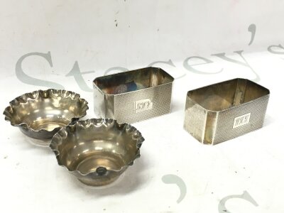 Two silver napkin rings and two silver saults, 80g total weight