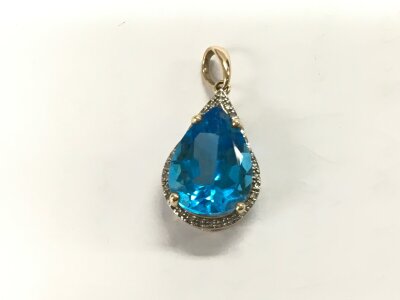 A 9ct gold pendant set with a large topaz surrounded by diamond chips, approx 7.8g.