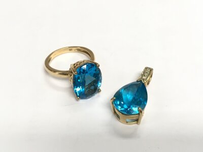 A 9ct gold ring and pendant set with a topaz and diamond chips, approx total 10.4g.