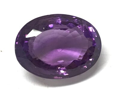 An oval amethyst 34ct 23mmx17mm 13mm deep