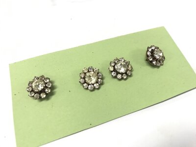 Four Victorian paste dress buttons silver clips