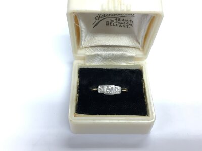 A 9ct gold three stone diamond ring, approx 1.2g and approx size H-I.