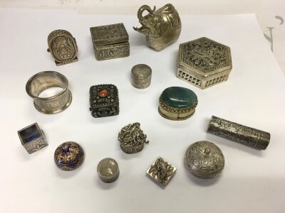 A collection of silver boxes pill boxes etc.
