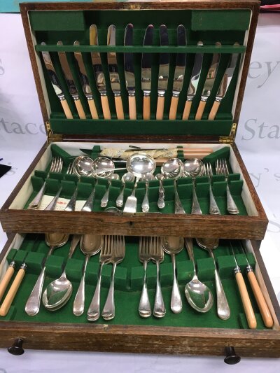 A canteen of silver plated cutlery plus five silver teaspoons.