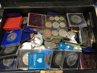 A metal box containing mainly crowns