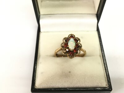 A 9ct gold, opal and ruby ring, approx 3g and approx size O.