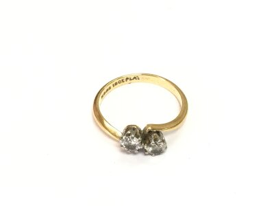 An 18ct gold diamond crossover ring, approx 2.2g and approx size K.