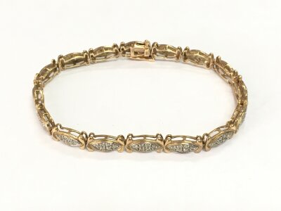 A 9ct gold line bracelet set with diamonds, approx 10g.