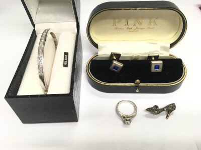 A silver bracelet, cufflinks, brooch and a ring.