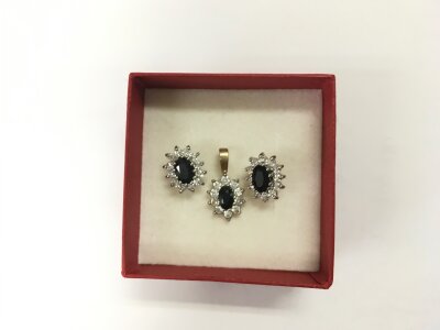 A pendant and a pair of matching stone set earrings.